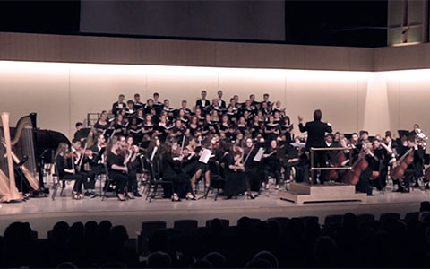 Student musicians and singers performing onstage in Glazer Music Performance Center