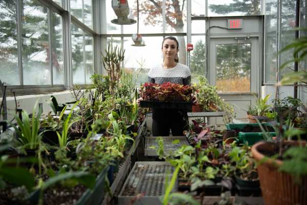 student in the Peckham greenhouse