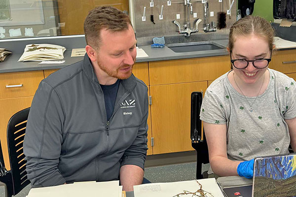 professor and student in biology lab