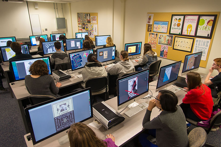 students creating typographic artwork in a computer lab