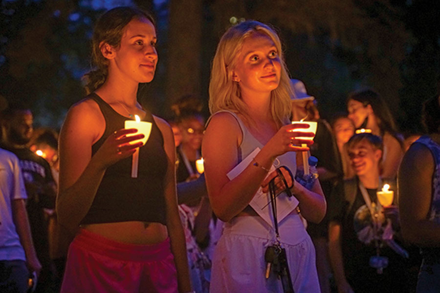 students holding candles at Convocation