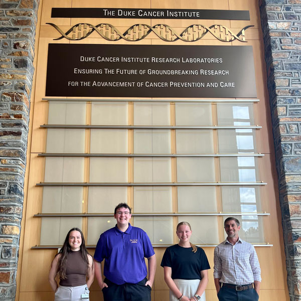 students standing together in the Duke Cancer Institute
