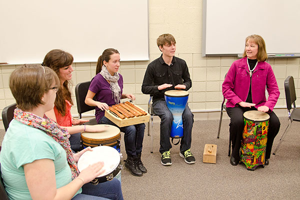 music therapy class playing percussion instruments