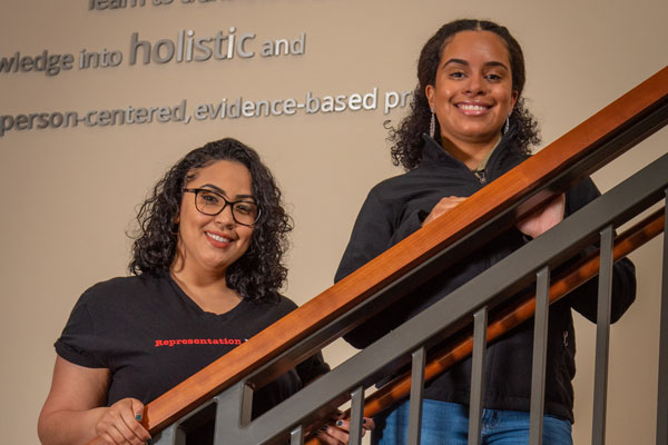 Noheli Ruiz and Jasmine Torres on staircase in York Wellness and Rehabilitation Institute