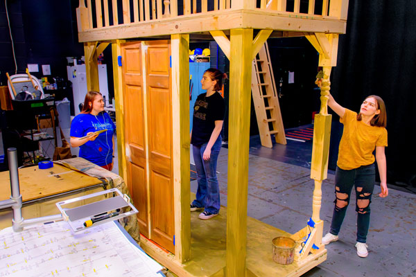 stage crew painting set for theater production