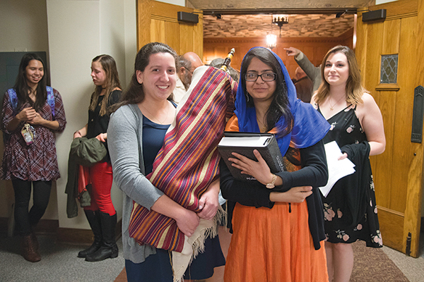 students holding religious paraphernalia