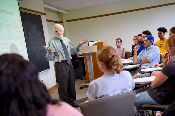 Mark Weber speaking to class