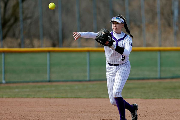 softball player pitching