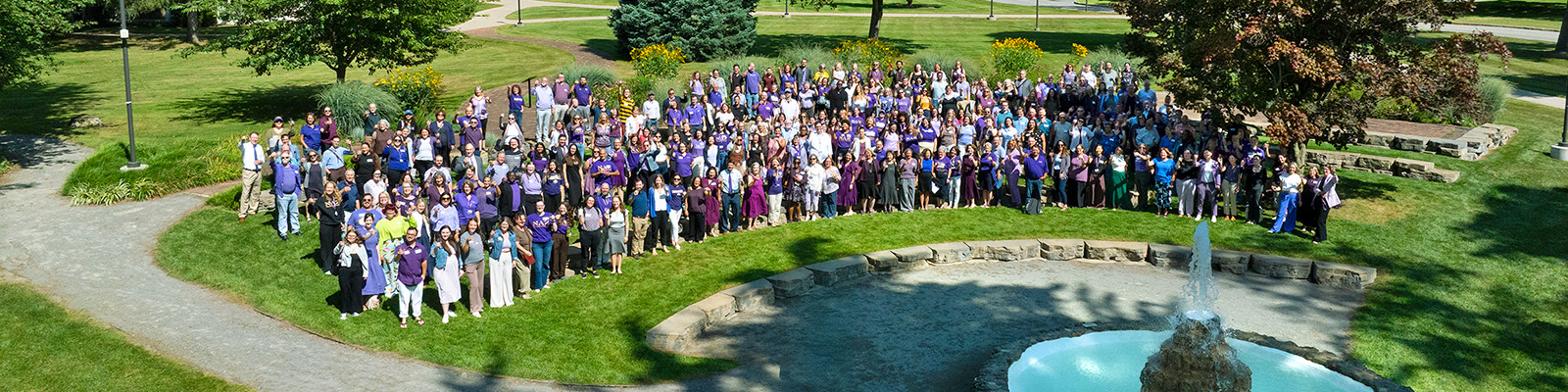 aerial view of faculty and staff group around fountain