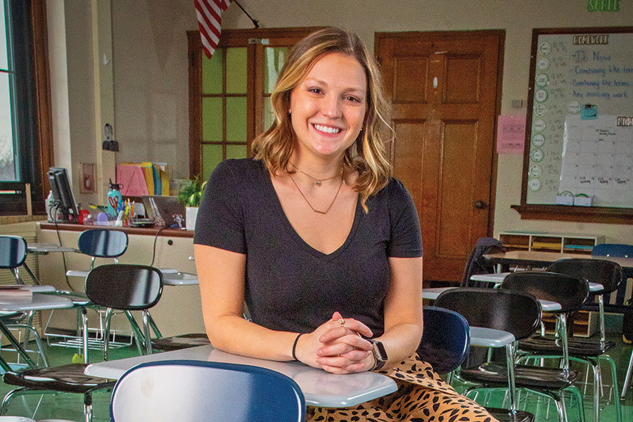 Kelsey Barrett sitting at a desk in a classroom