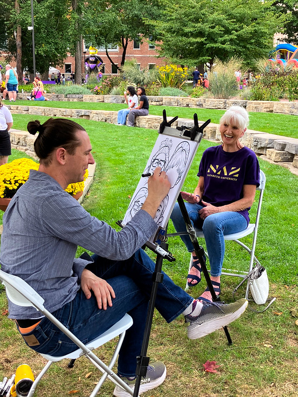 Woman poses for caricature 