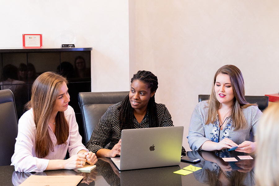 three female students meeting