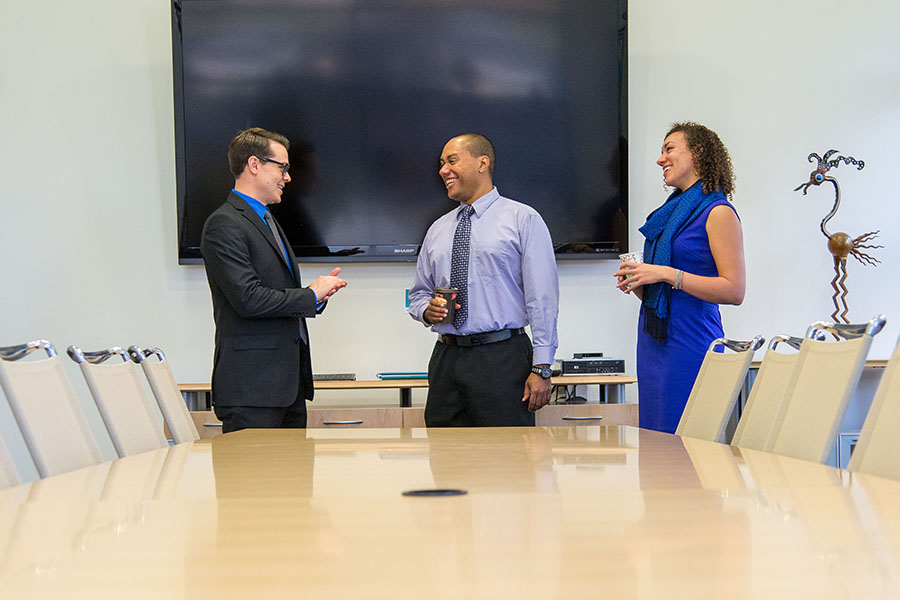 business students meeting next to conference table