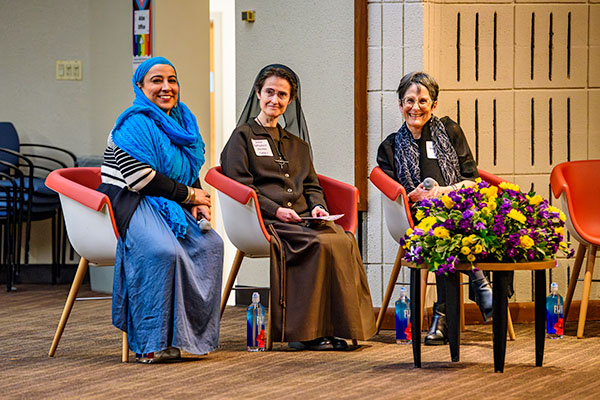 Najeeba Syeed, Raffaella Petrini, and Sharon Cohen Anisfield seated on stage