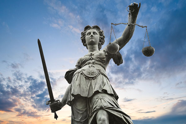 statue of Lady Justice holding sword and scales