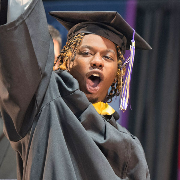 male graduate celebrating at commencement