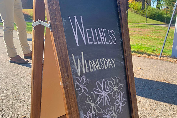chalkboard sign saying "Wellness Wednesday"