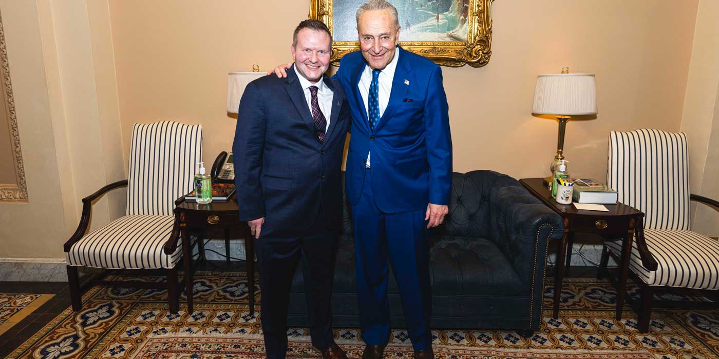 Kozlowski with U.S. Sen. Charles Schumer at the State of the Union address.