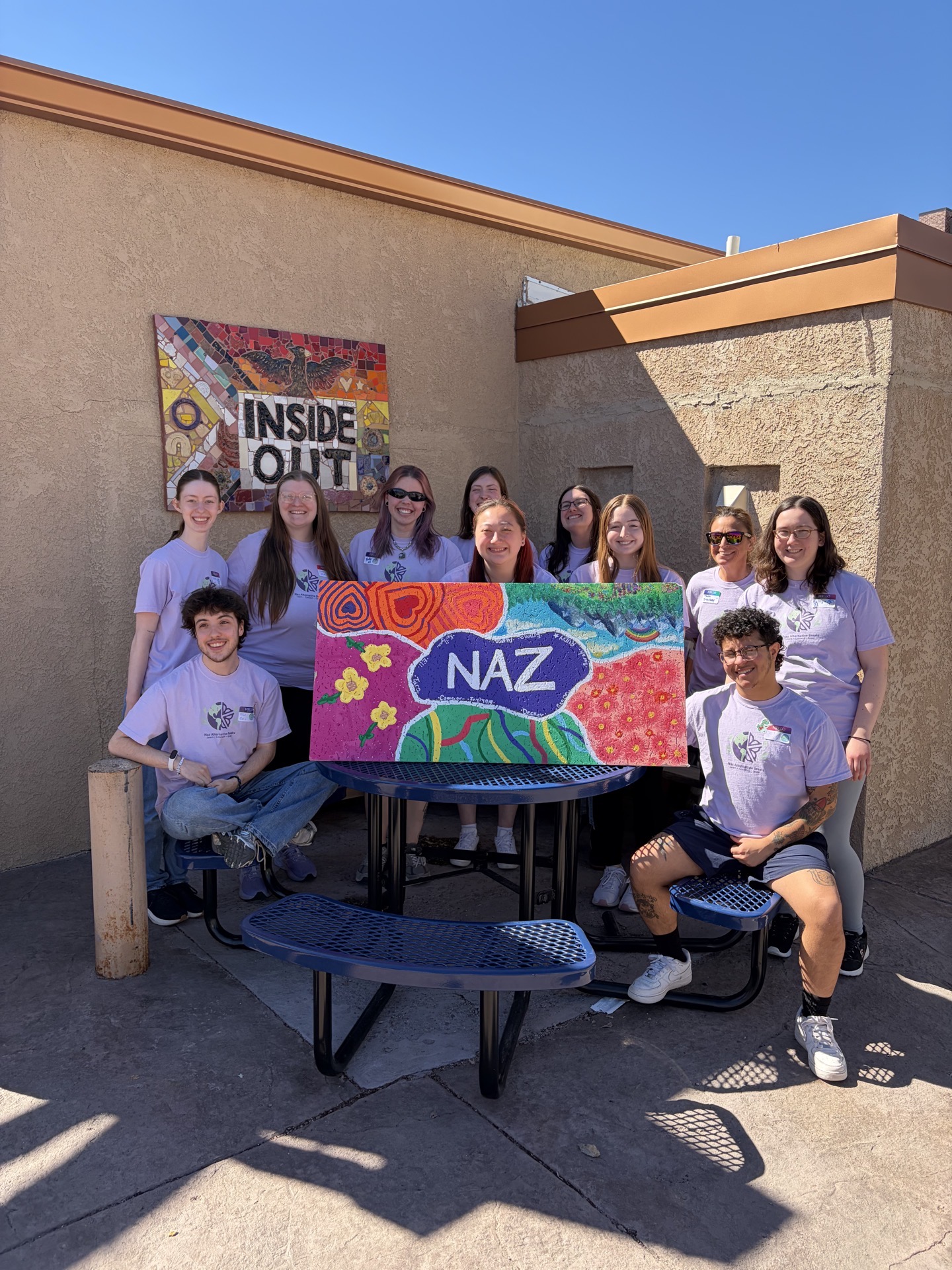 Students with painted sign