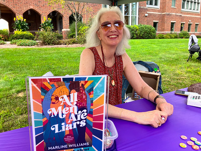 Marline Williams '95 poses with her book 