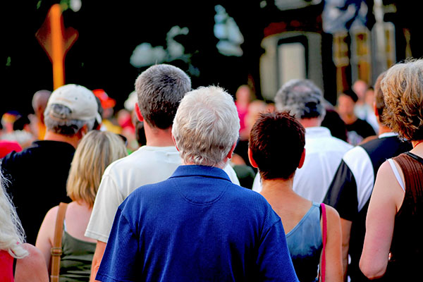 crowd walking away from camera