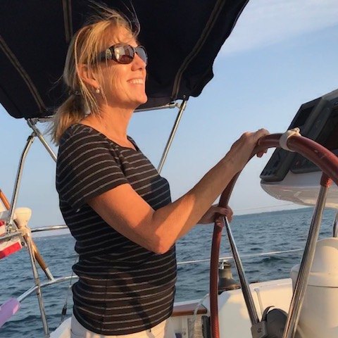 Rubin Rudy steering sailboat