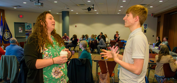 Jacob Koles talks with Elissa Burke, chief programs officer at Starbridge.