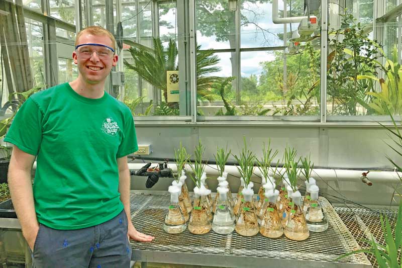 Jacob Murphy in the greenhouse