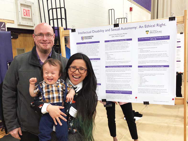 Joanna Parker and her family by her master's thesis poster