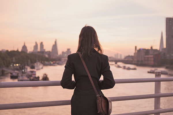 businesswoman overlooking city skyline