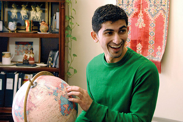 international student with globe