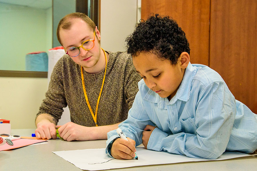 art therapy session between student and child