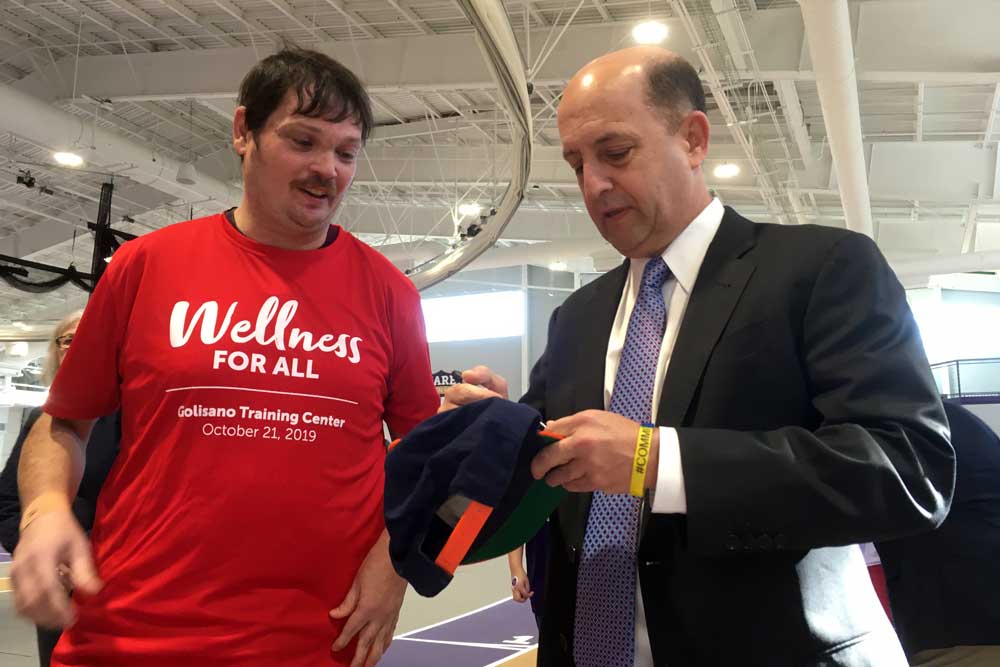 Jeff Van Gundy '85 signs a hat for an attendee from the Special Olympics.