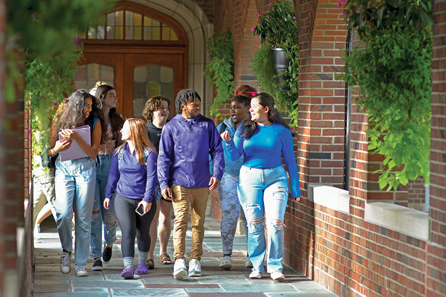 student group walking in cloister