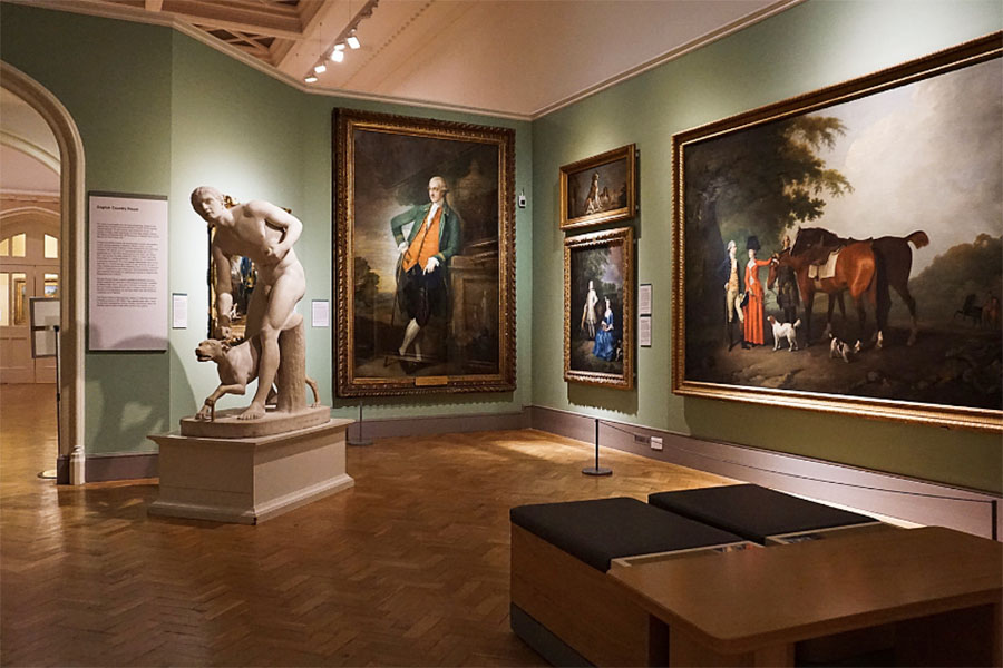 sculpture and paintings on display in museum