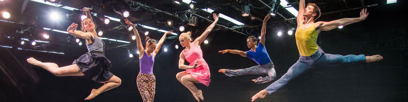 dance students leaping into the air