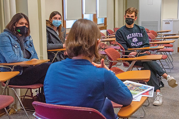 Andrew Wicklum looks at a guest speaker in Equitable Spaces class