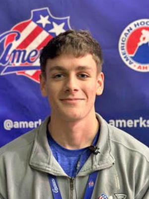 Karson LaRose in front of Amerks logo