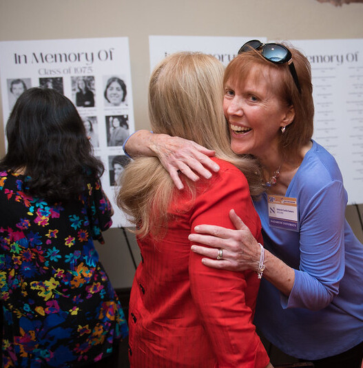 Ladies from the Class of '75 embrace Ladies from the Class of '75 embrace