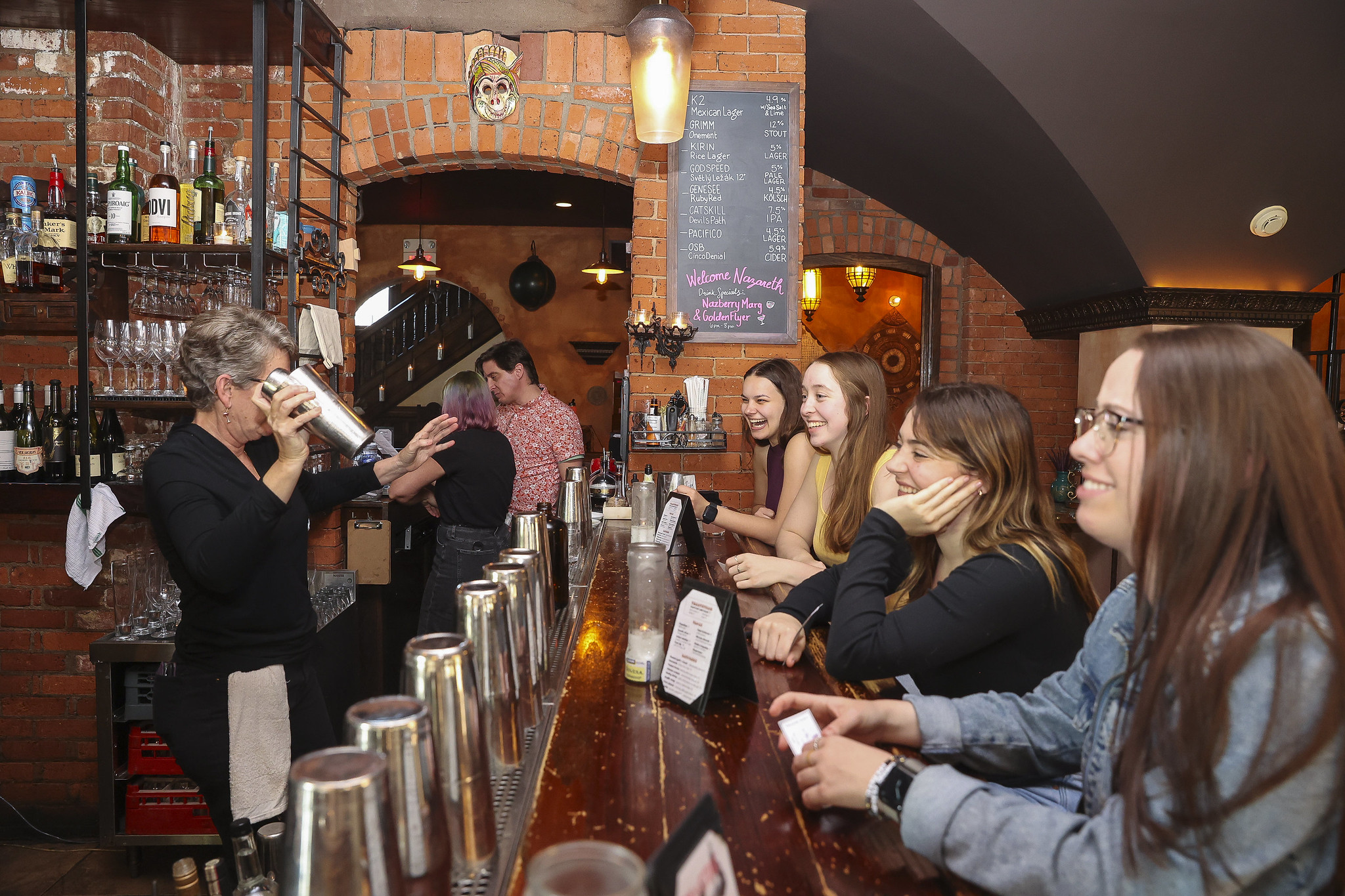 Beth Paul bartending at Senior Donor Happy Hour