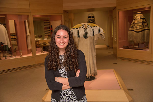 Julia Madore in front of a museum exhibit