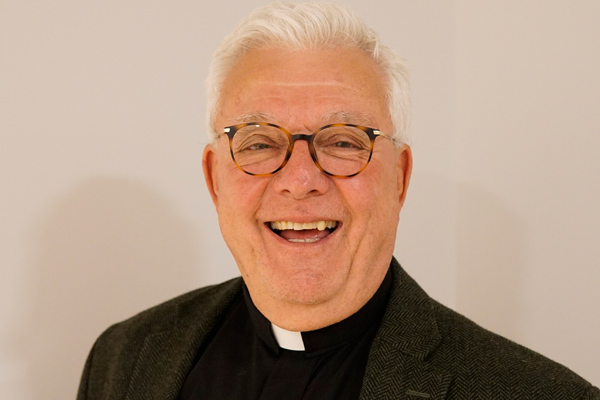 Thomas W Florek, SJ, in a priest's collar