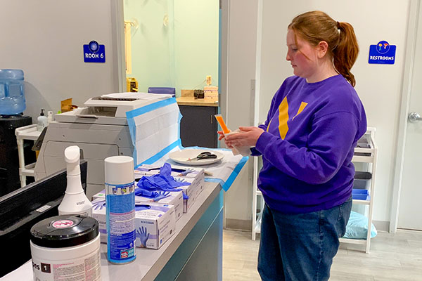 Ann Tavernier working in an urgent care lab