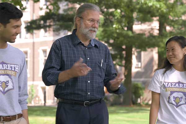 Tim Bockes teaching students on a walk