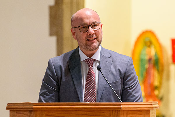 Alan Pascuzzi speaks at the chapel podium, a Shannon Centennial Summit lecture