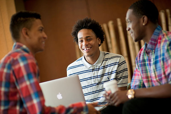 students in discussion while studying