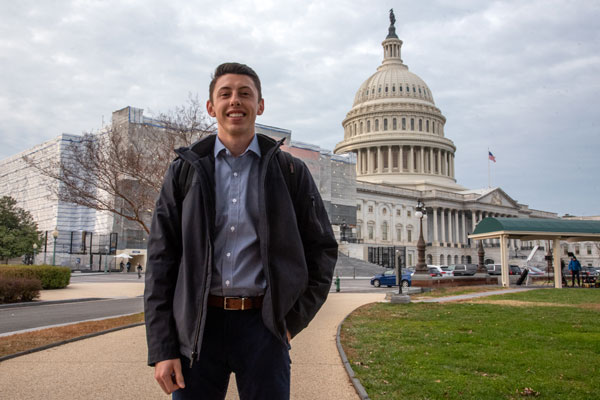 Harrison Kane standing in front of the U.S. Capitol building