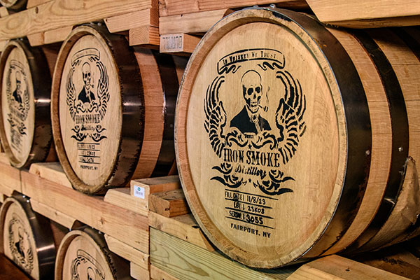 barrels of whiskey with the Iron Smoke Distillery logo