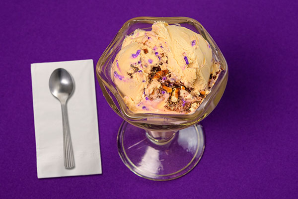 ice cream in a dish, spoon, napkin