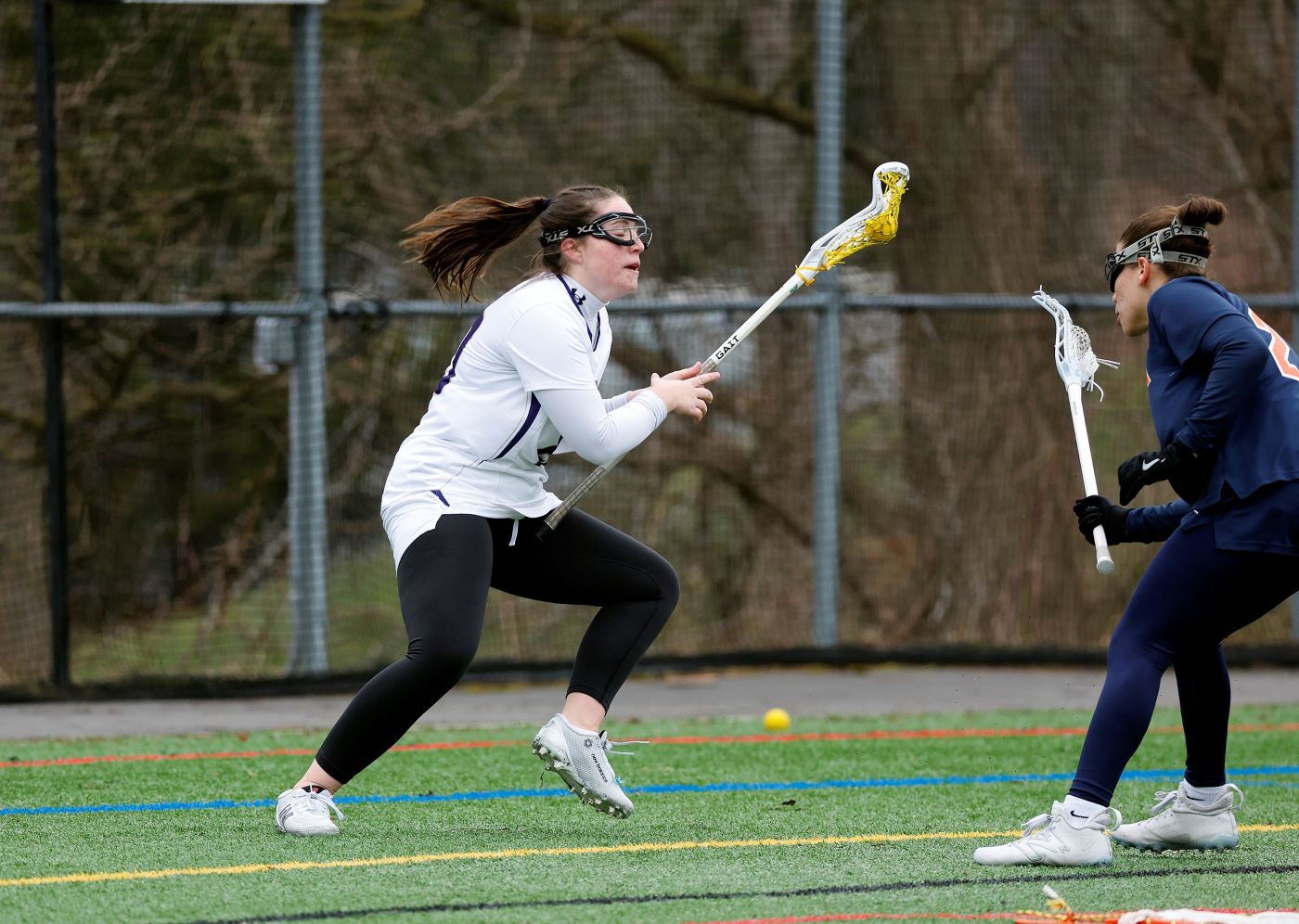 Women playing lacrosse